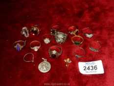 A quantity of dress rings set with various coloured stones, icon etc.