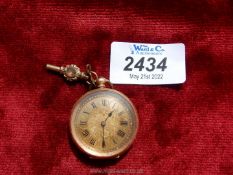 A 14 kt gold wind up Pocket Watch with floral and foliage engravings to the back and centre of the