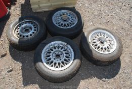 Three alloy BMW wheels and tyres and a BMW wheel and tyre with steel rim 195/160/14.