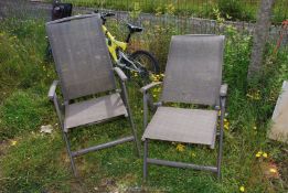 Two fold up metal/plastic garden chairs.