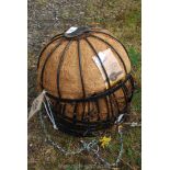 Six metal hanging baskets.