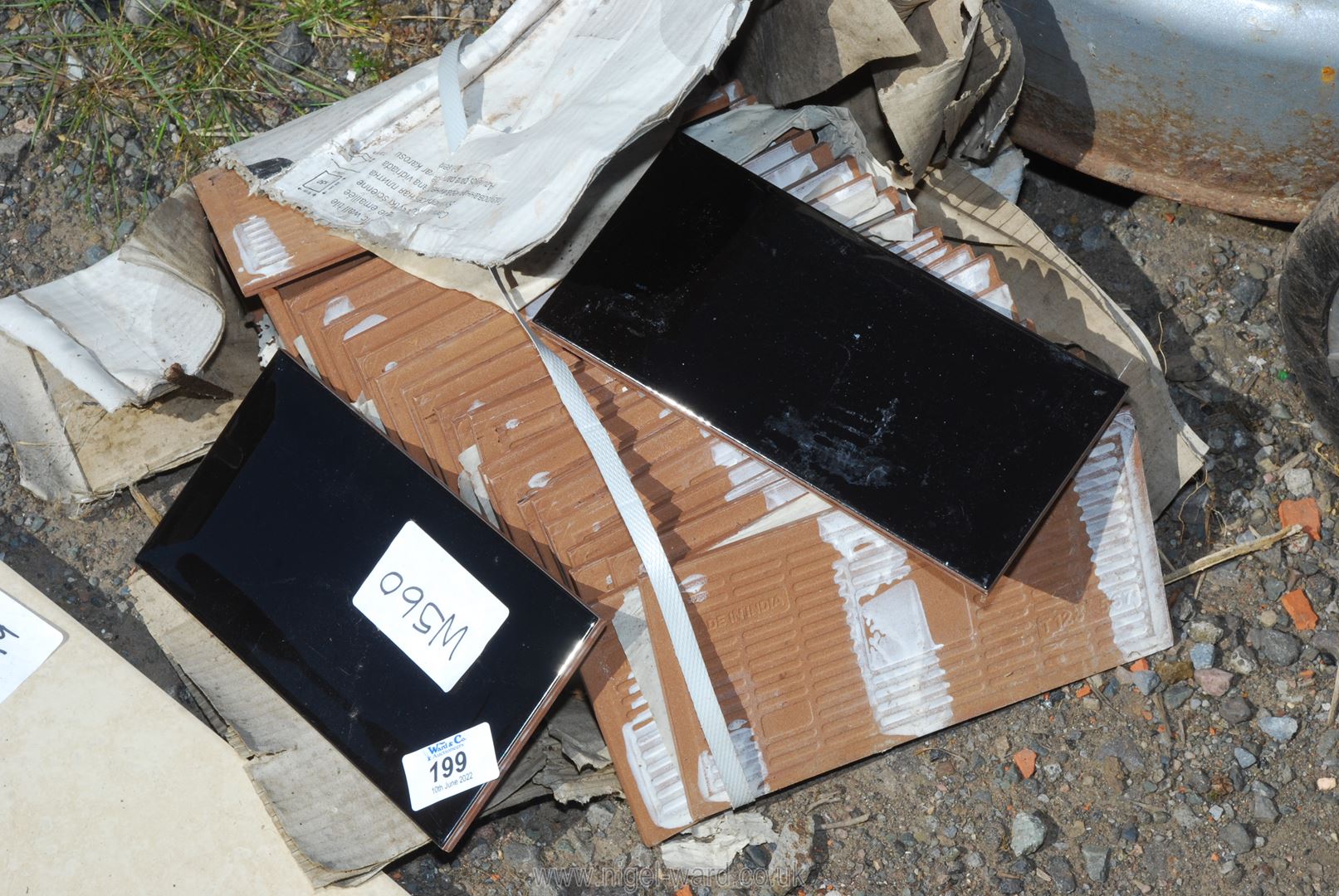 A quantity of black glass bevelled edge Subway Tiles.