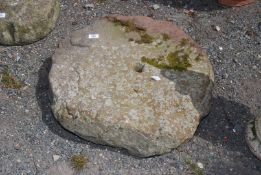 A stone plinth, 2' diameter x 5" thick.