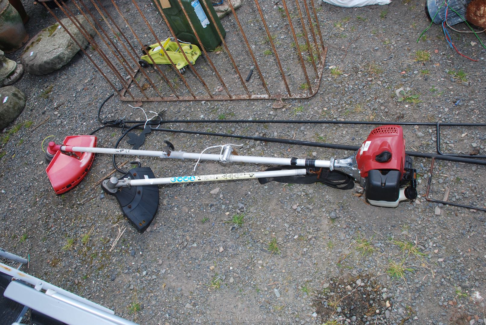 A Petrol Strimmer in running order with extra head.