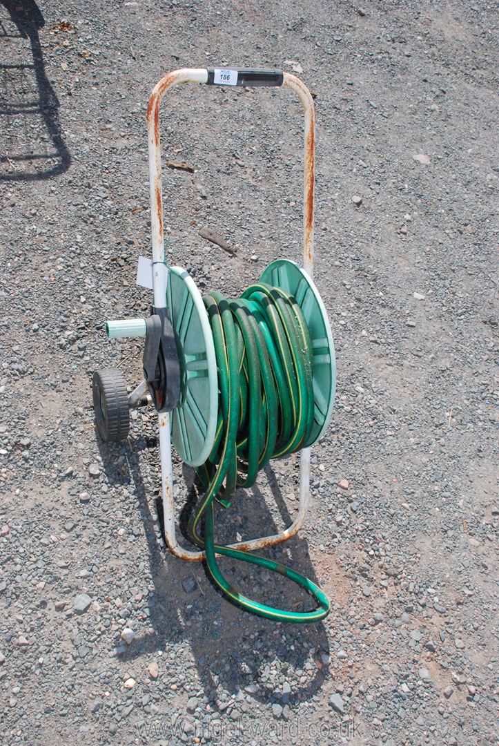 A wheeled hose on reels. - Image 2 of 2