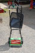 A Challenge Push mower with grass collector.