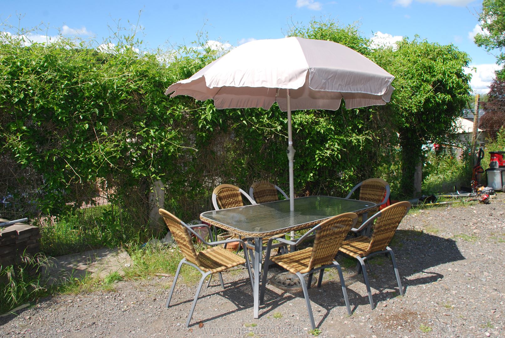 A glass patio table, six chairs and umbrella (no drive bar). - Image 2 of 3