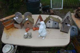 A wooden tool carrier, five bird boxes, bunny and cat ornaments, etc.