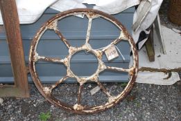 A circular opening cast/wrought iron window, 30" diameter.