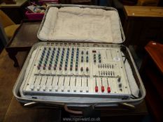 A Sound Lab G742 powered mixing desk in suitcase.