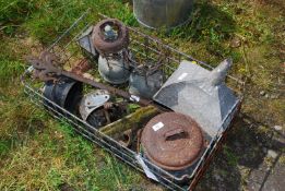 A metal crate, zinc funnel with filter, old lamps, hinges, etc.