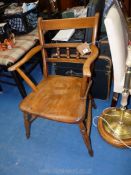 An Elm seated and other woods elbow Chair with spindle back.