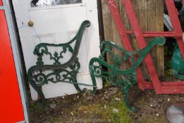 A pair of metal bench ends.