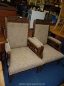 A pair of Edwardian Mahogany upholstered fireside Chairs with carved detail to back.