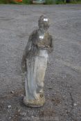 A concrete statue of a lady 40" tall.