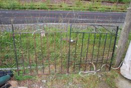 A pair of pedestrian garden gates, each 34 1/2" x 35 1//2" with latches and hinges.