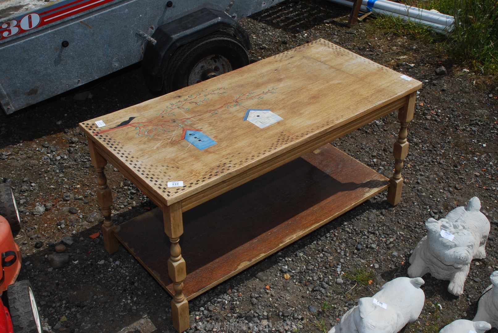 A coffee table with lower shelf, 38" x 18" x 19" high.