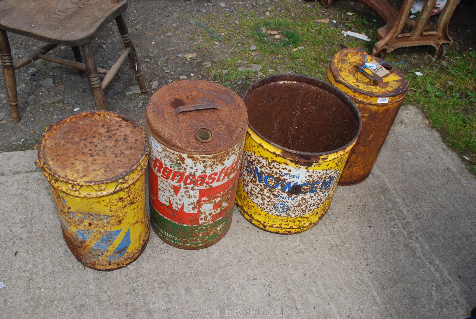 Four old workshop drums, Snowcem and Castrol.