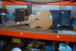 A small guitar and a Sony music centre.