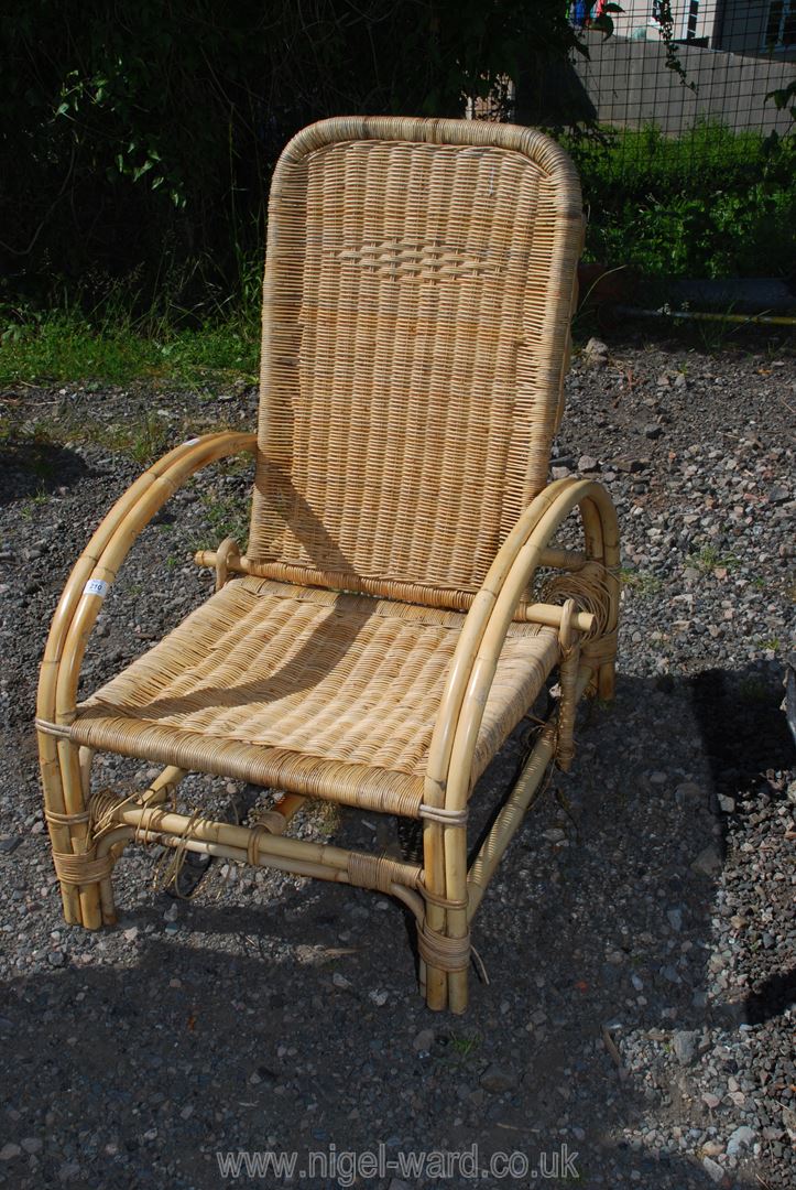 A rattan recliner chair.