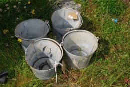 Four galvanised buckets.