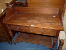 A Pine washstand with lower shelf.