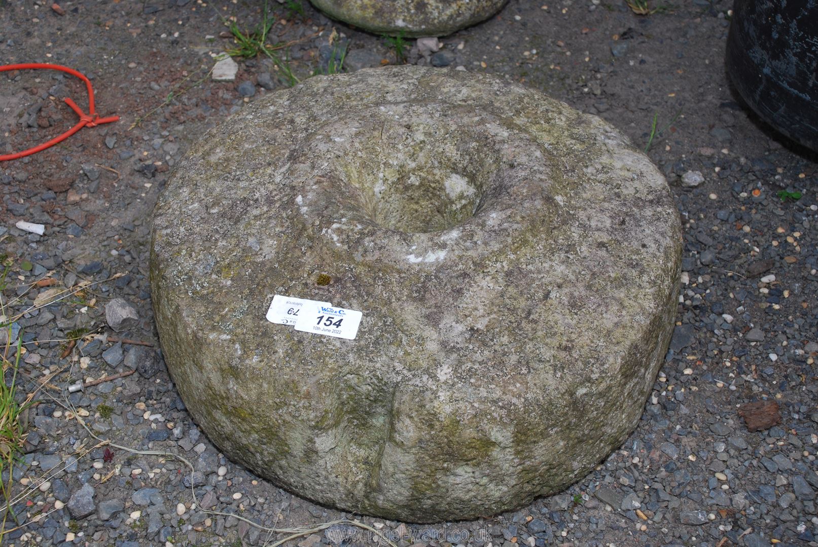 A cider press stone, 14'' diameter.