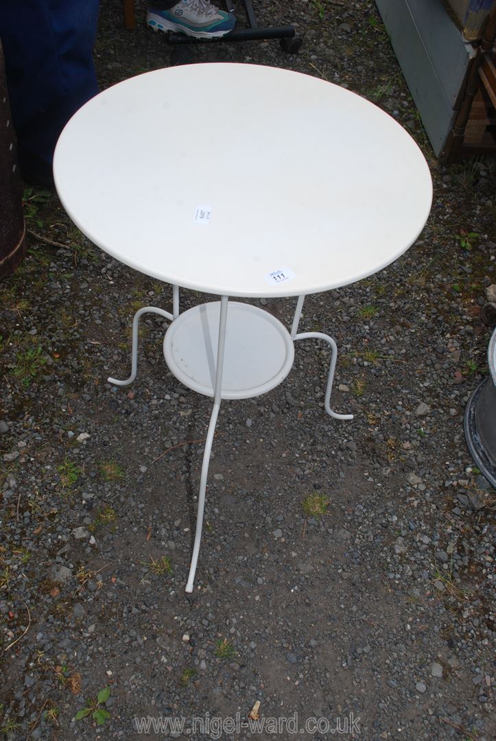 A cream painted circular metal table, 27" high x 20" diameter. - Image 2 of 2