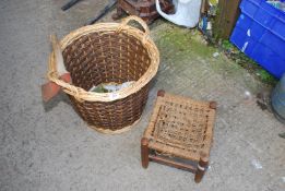 A log basket with hatchet and small rope topped stool.