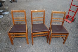 Three kitchen chairs.