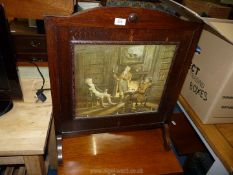 A wooden fire screen with period picture insert.