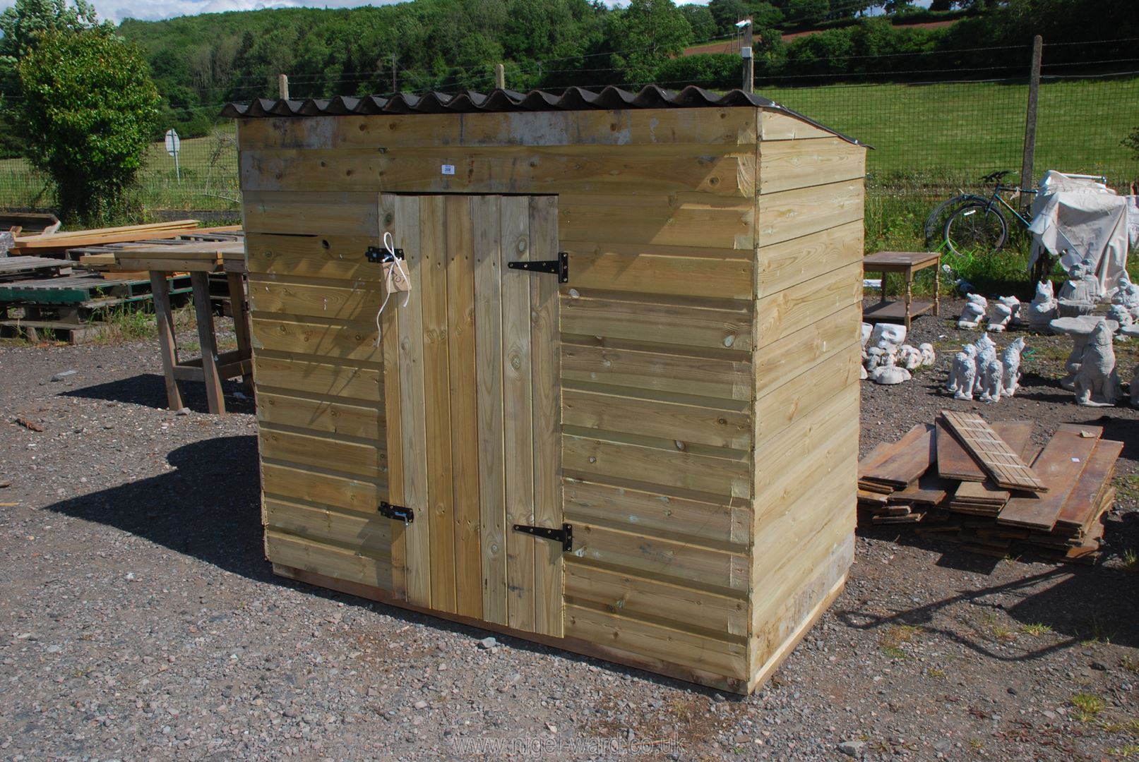 A garden shed, 62" wide x 56" high x 32" deep.