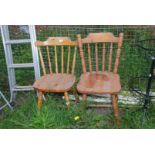 Two pine kitchen chairs.