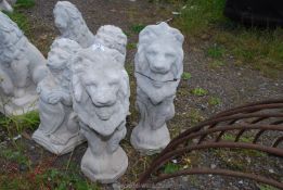 Two concrete seated lions.