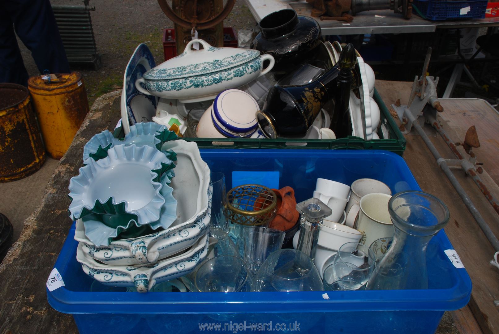 Two crates of mixed glass and china lamp shades.