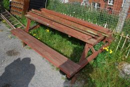 A picnic bench with extra slats, 70 1/2'' long x 54'' x 29'' high.