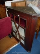 A Mahogany glazed corner cupboard.