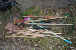 A quantity of canes, spades, shovel, loppers, etc.