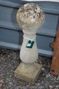 A column with ball top, 25" high.