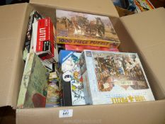 A large box of jigsaw, games, etc.