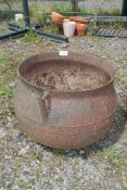 A cast cauldron (hole to base)
