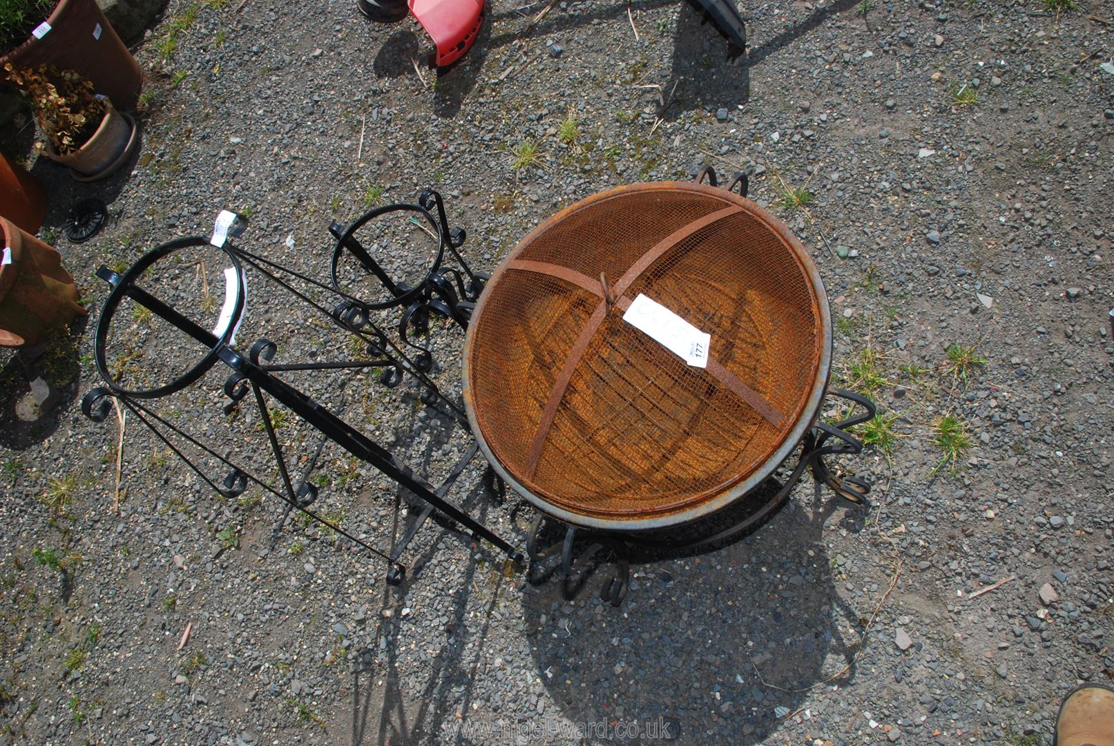 A fire pit and 2 pot holders.