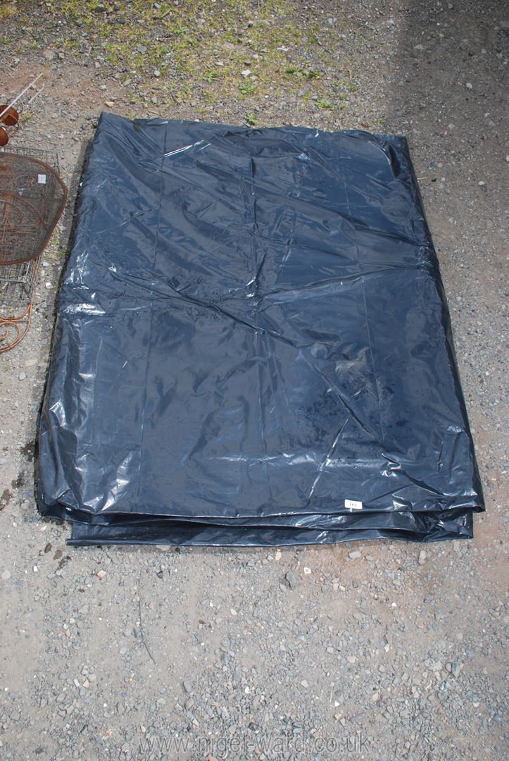 A large black plastic sheet.