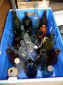 A quantity of old bottles, some named.