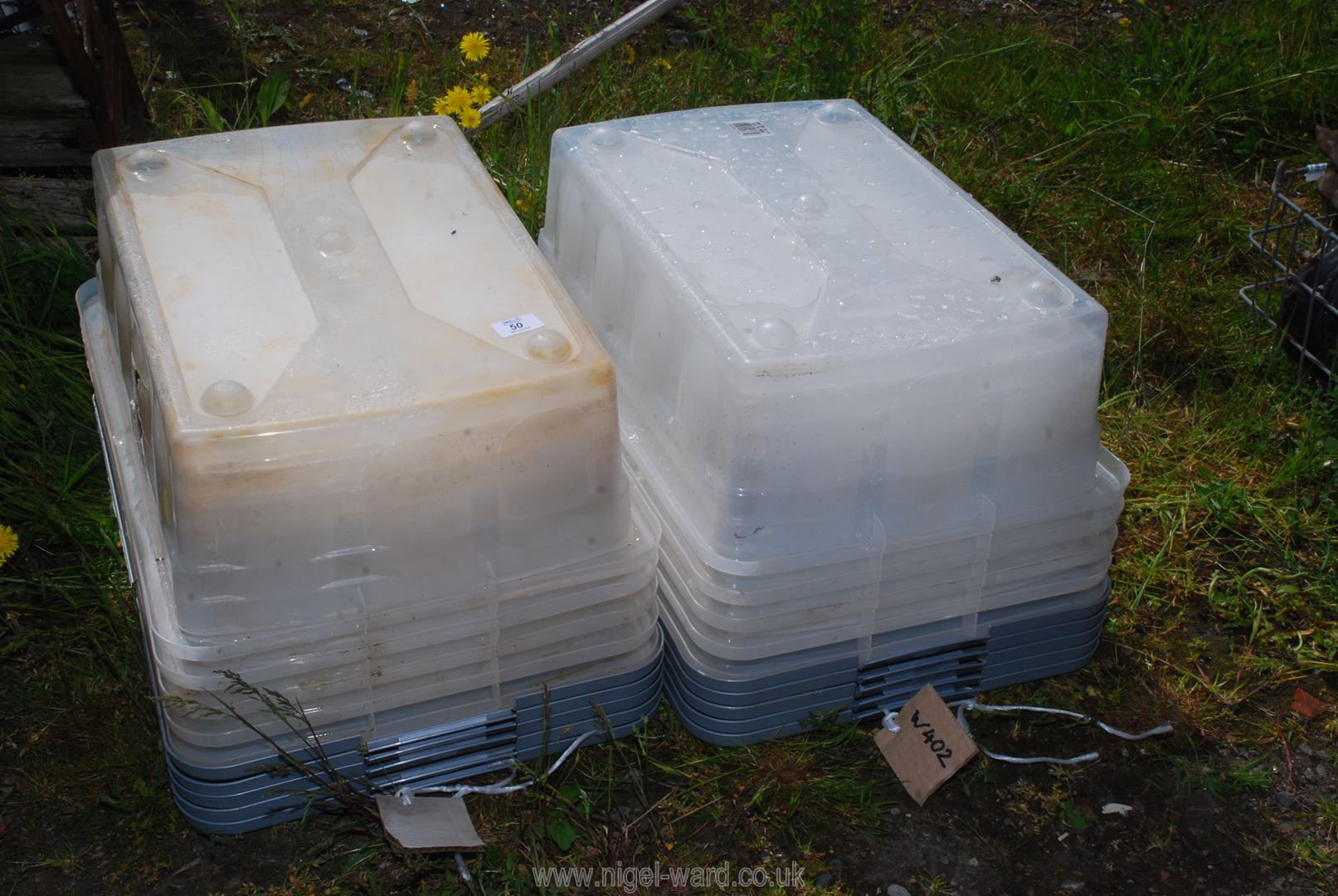 A quantity of plastic storage boxes.