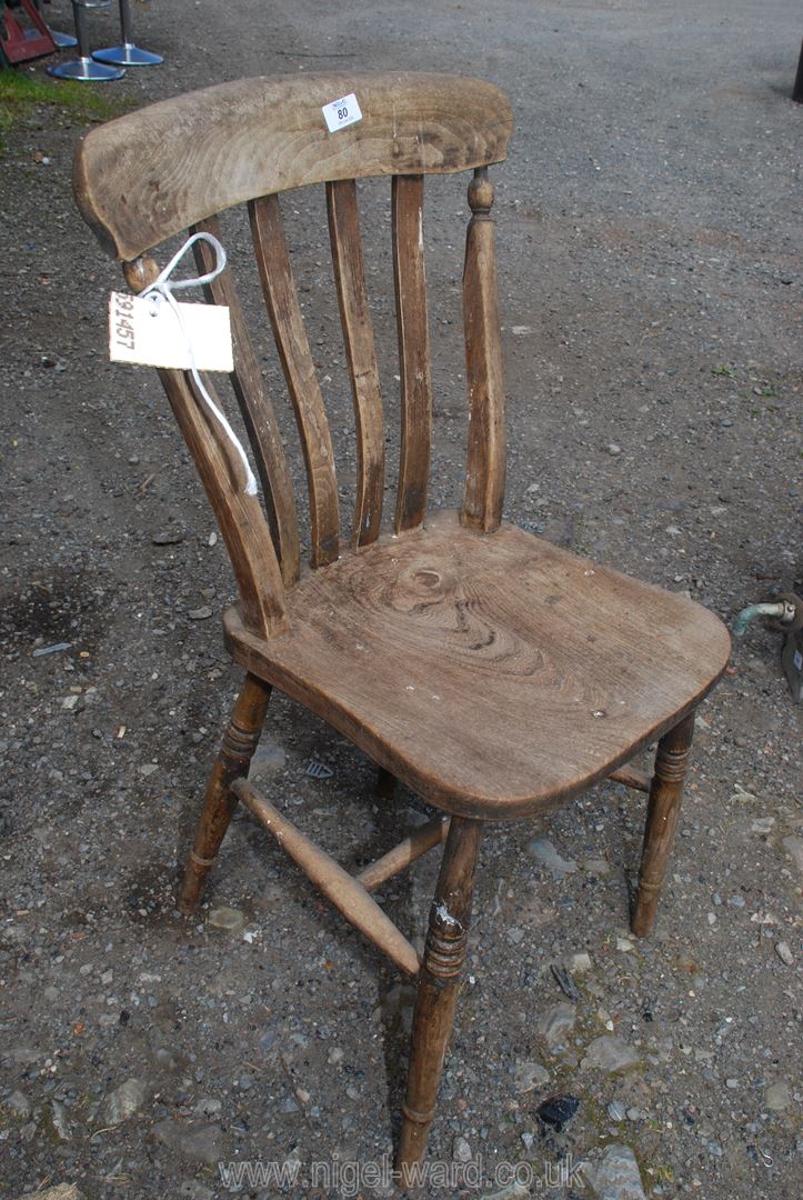 A wooden kitchen chair.