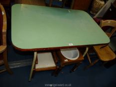A green vintage formica kitchen table.