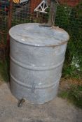 A galvanised container, no lid, with tap, 29 1/2'' high x 25'' diameter.