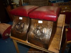 A pair of copper fireside coal buckets with padded seats.