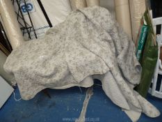 A grey double bed throw.